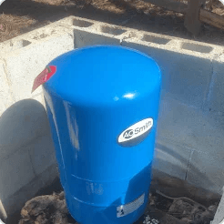 Customer photo of a blue residential well pressure tank