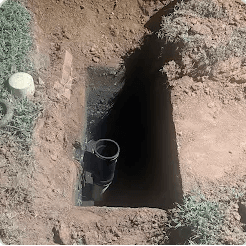 Customer photo of an outdoor plumbing excavation